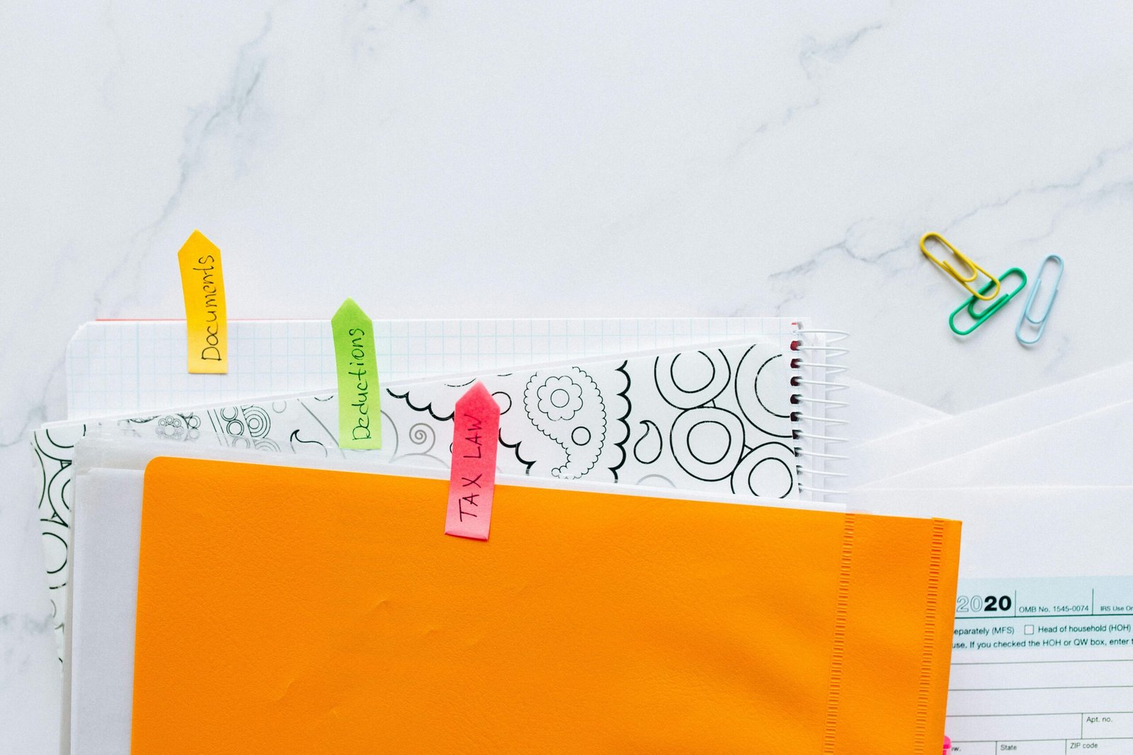 Teenager creating a monthly budget using colorful sticky notes