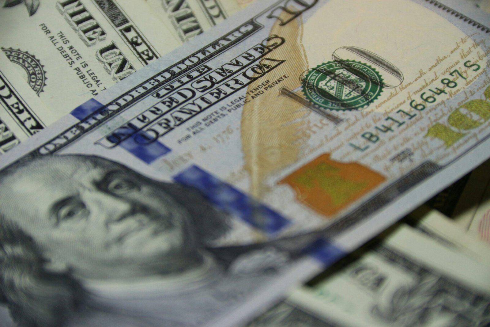 teenager saving money in piggy bank